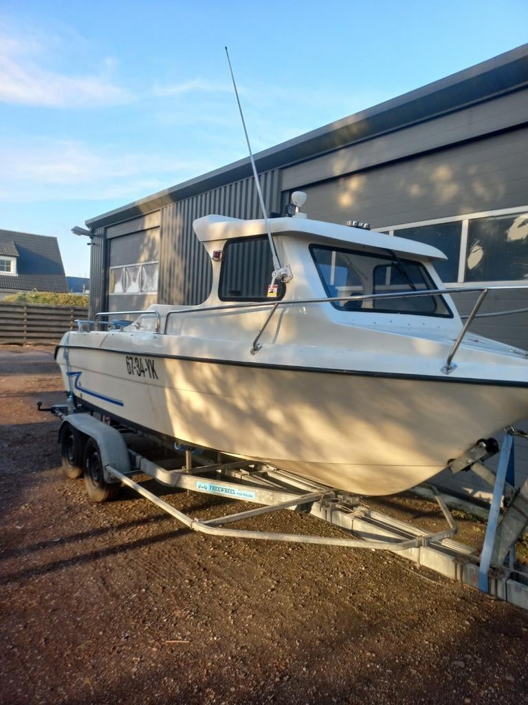 sanita 600 flipper kajuitvisboot, Watersport en Boten, 70 pk of meer, Gebruikt, Ophalen of Verzenden, Buitenboordmotor