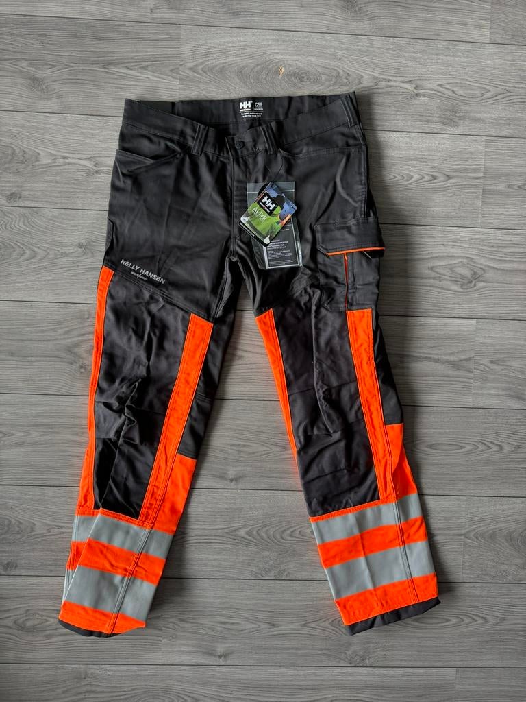 Helly Hansen werkbroek Alna 2.0 – Oranje – Nieuw – C56, Tuin en Terras, Werkkleding, Nieuw, Heren, Broek, Ophalen