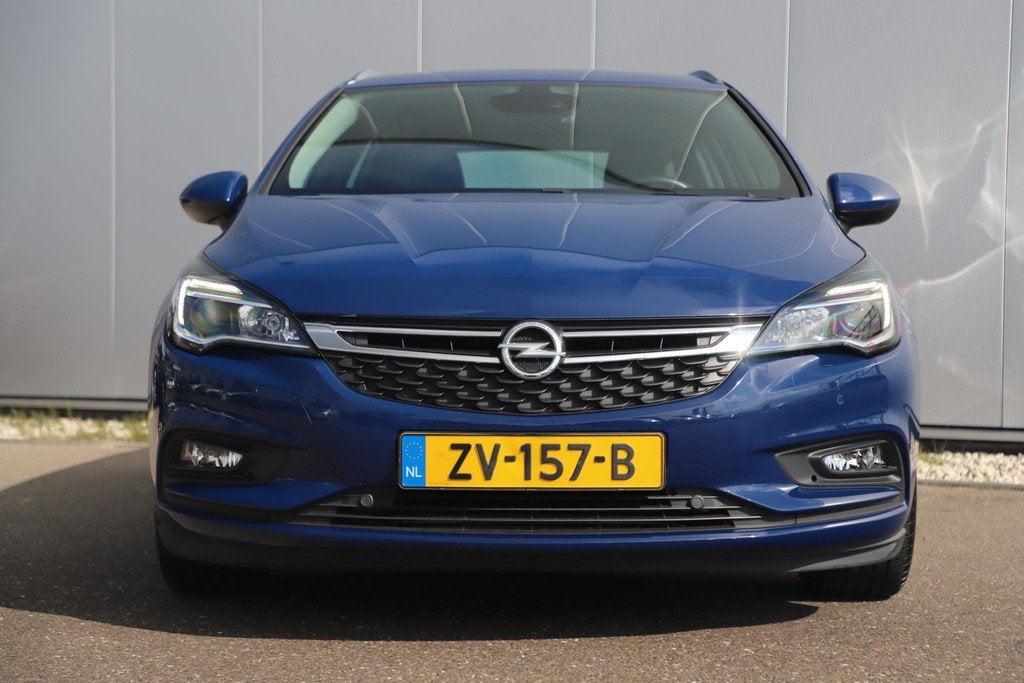 Opel Astra Sports Tourer 1.0 Turbo Business Executive 105PK, Auto's, Stof, Gebruikt, 1178 kg, Met garantie (alle)