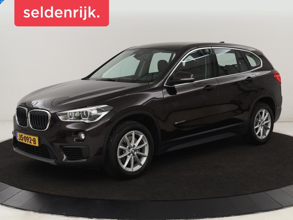 BMW X1 sDrive20i High Executive | 84.150km NAP | Trekhaak |, Auto's, 1998 cc, Bruin, Bedrijf, SUV of Terreinwagen