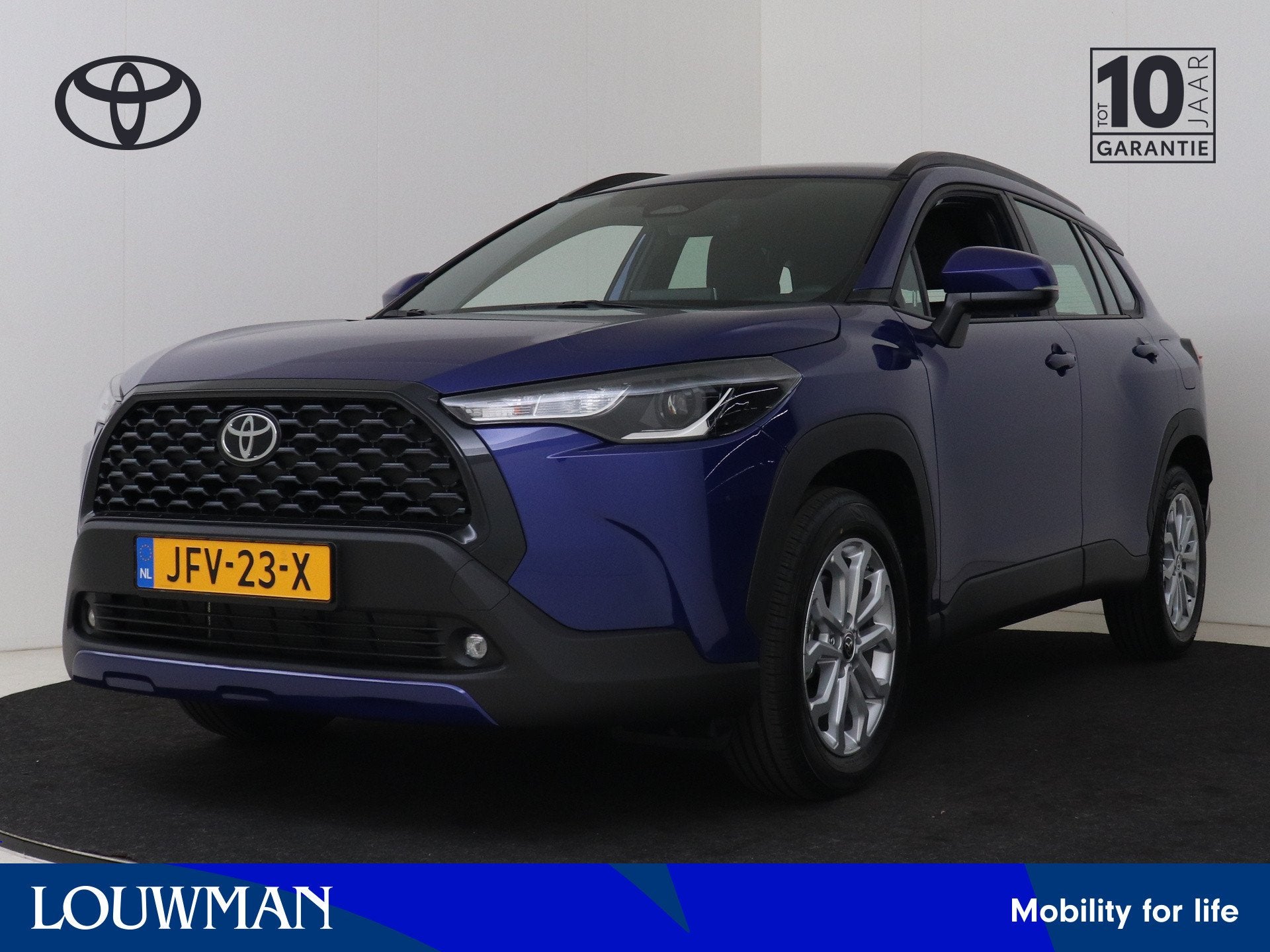 Toyota Corolla Cross Hybrid 140 Active (bj 2025, automaat), Auto's, 12 maanden, Stof, Blauw, Stoelverwarming