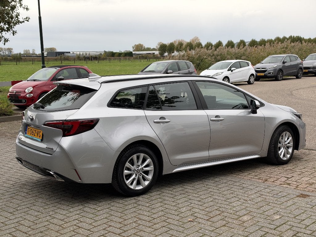 Toyota Corolla TS Hybrid 140 Active | FACELIFT, Auto's, 4 cilinders, Verwarmde buitenspiegels, Corolla, Hybride Elektrisch/Benzine