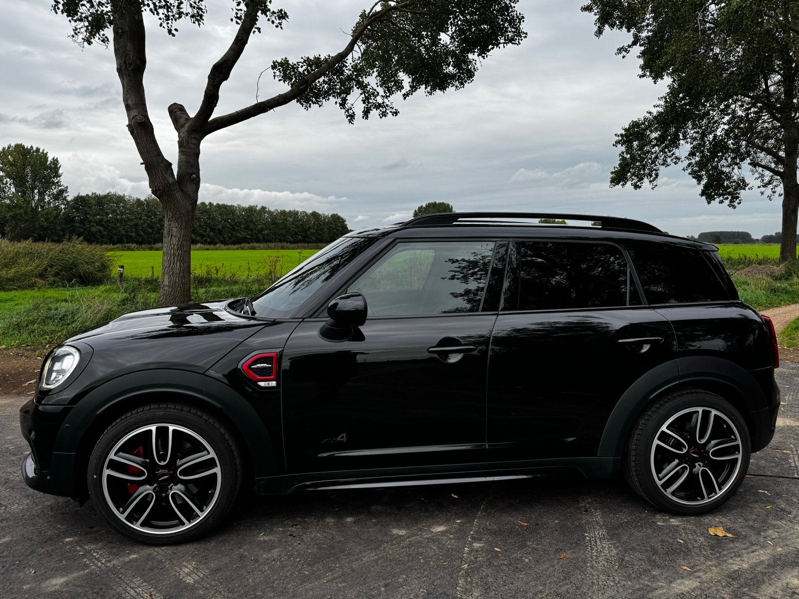 Mini Countryman JCW 231pk All4 Aut. ACC Pano Carplay Works, Auto's, Automaat, Zwart, Zwart, Vierwielaandrijving