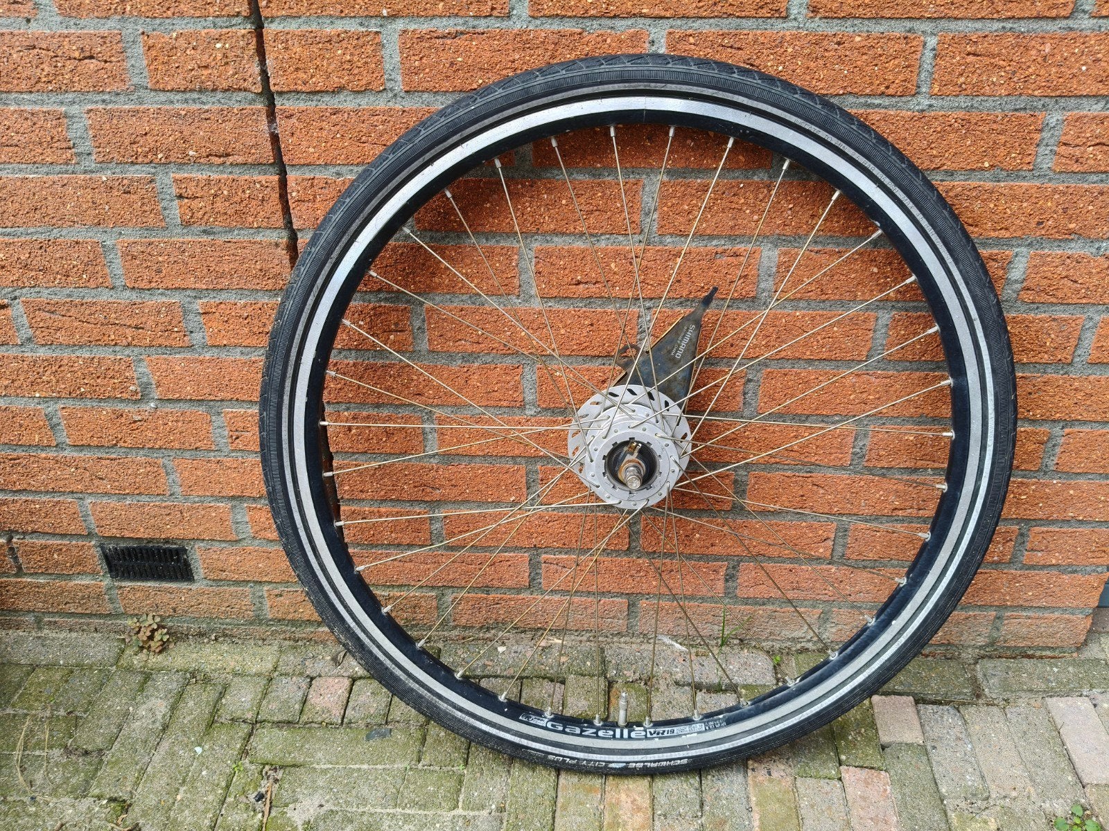 28 inch voorwiel met naafdynamo en rollerbrake, Fietsen en Brommers, Ophalen, Gebruikt, Stadsfiets, Wiel