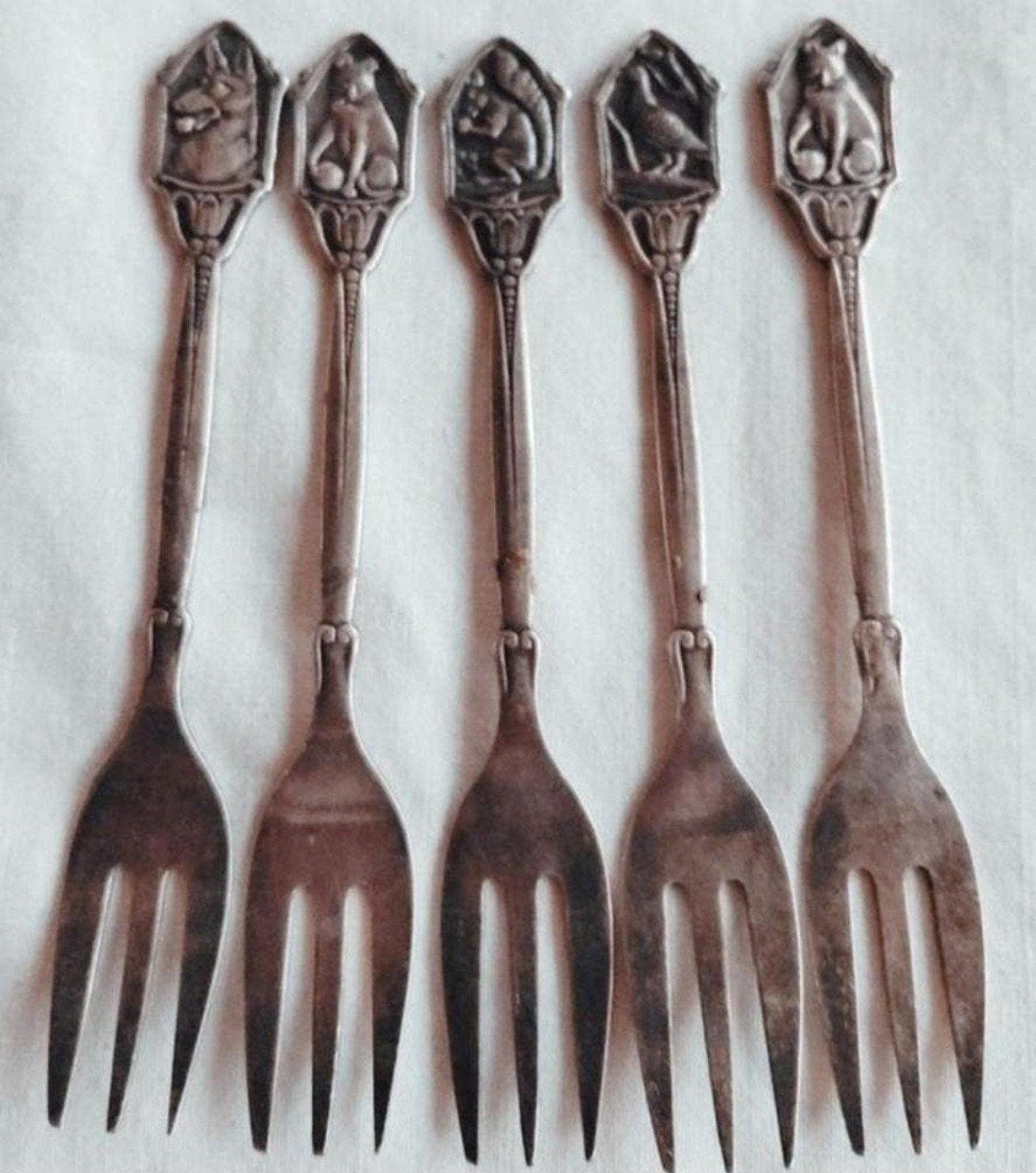 Verzameling verzilverde vorkjes reliëf dieren, Ophalen of Verzenden