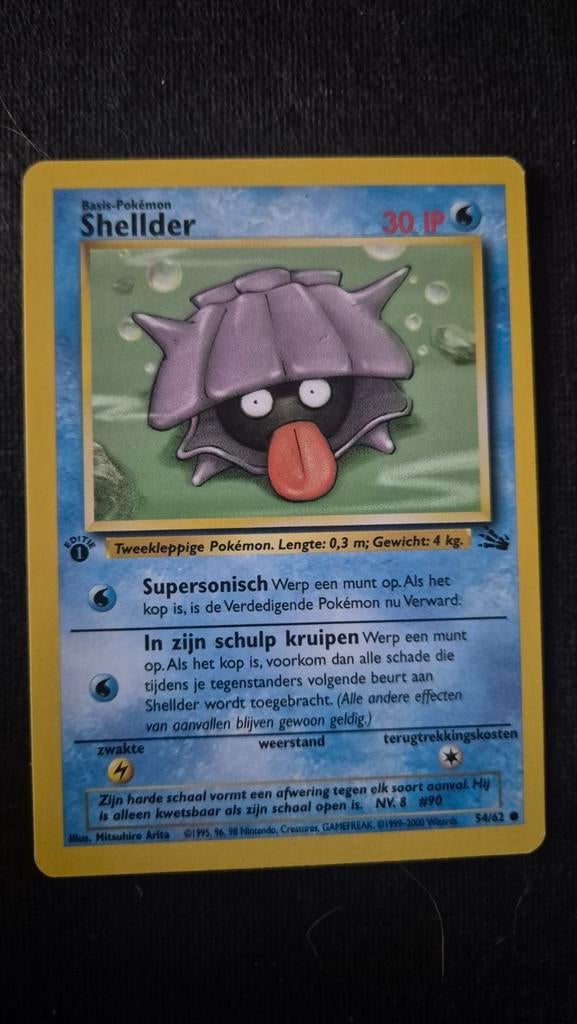 Pokemon Kaart Shellder First Edition Nette Staat, Ophalen of Verzenden, Zo goed als nieuw, Losse kaart