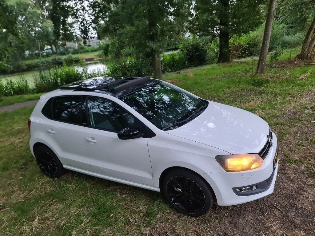 Volkswagen Polo 1.2 60PK 2012 Panoramadak APK tot 04-2027., Auto's, Voorwielaandrijving, Euro 5, Zwart, 60 pk