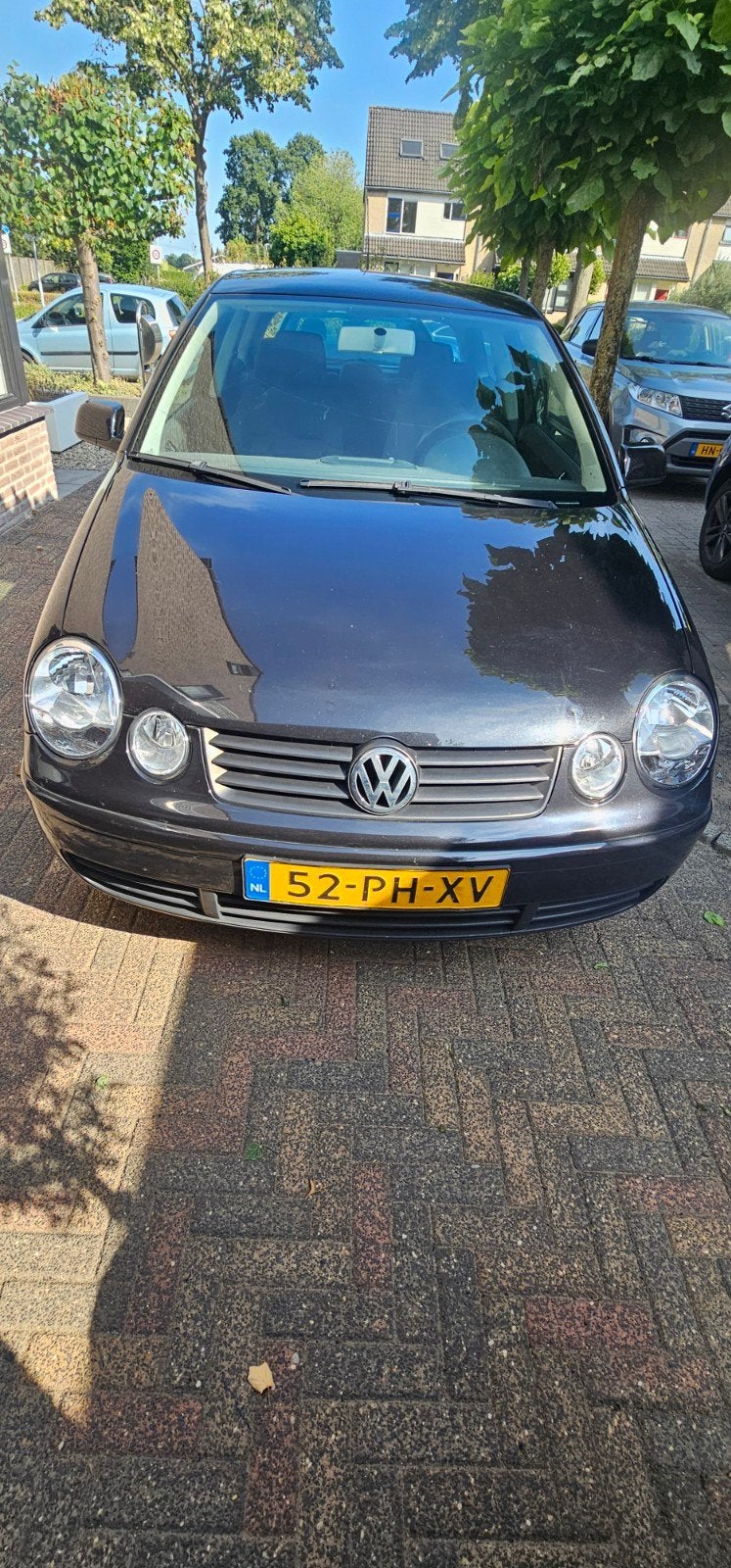 Volkswagen Polo 1.4 55KW 2004 Zwart, Auto's, Voorwielaandrijving, 4 cilinders, Zwart, Origineel Nederlands