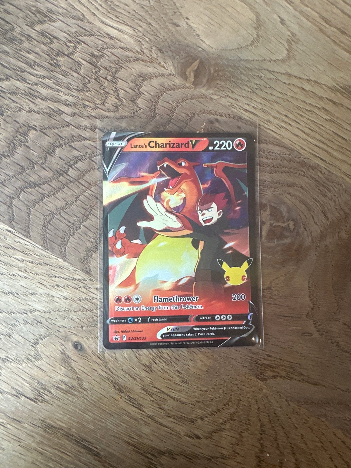 Lance's Charizard V SWSH133 Pokémon Kaart Celebrations, Ophalen, Zo goed als nieuw, Losse kaart