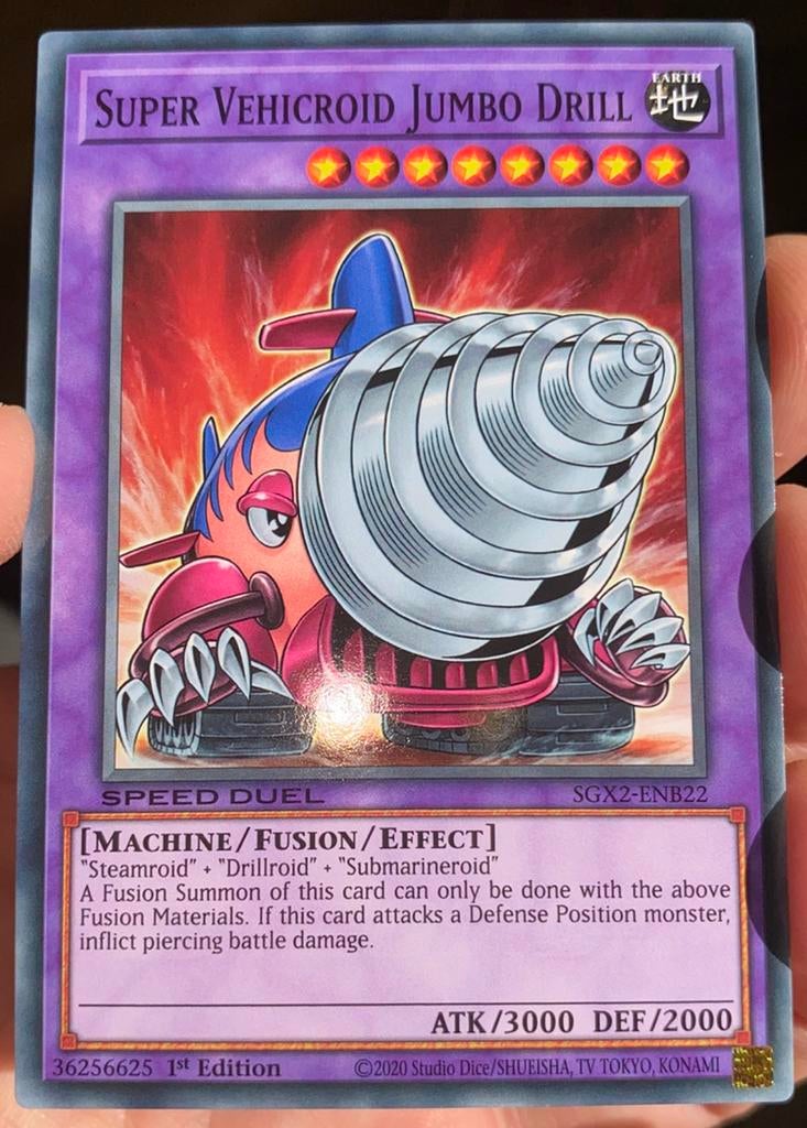 Yu-Gi-Oh! Super Vehicroid Jumbo Drill SGX2 1st Edition !, Ophalen of Verzenden, Zo goed als nieuw, Losse kaart