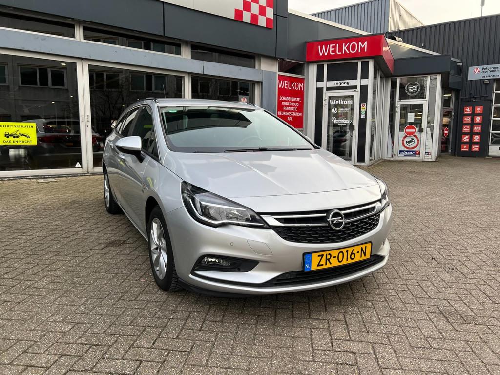 Opel Astra Sports Tourer 1.4 Turbo 120 Jaar Edition, Voorwielaandrijving, Stof, Gebruikt, Euro 6