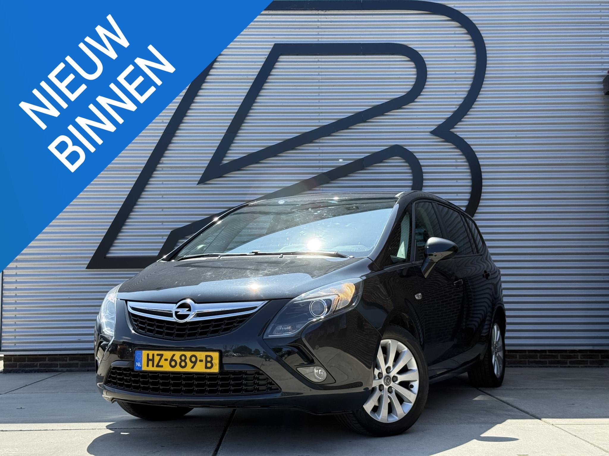 Opel Zafira Tourer 1.4 Cosmo 7p. 1e Eigenaar|Camera|Trekhaak, Auto's, Opel, Euro 5, Stof, Gebruikt, Zwart