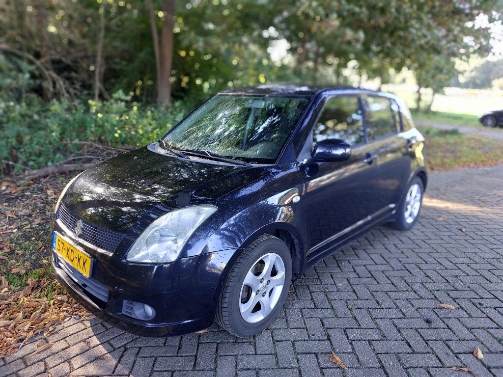 Suzuki Swift  SHOWGUN 1.3 5DRS 2007 Zwart Tekst Lezen!, Stof, 40 €/maand, 965 kg, 400 kg