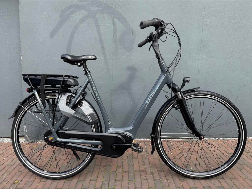 Gazelle Orange C7+ D61cm 400W 2932KM Garantie, Ophalen, Zo goed als nieuw, 59 cm of meer, 50 km per accu of meer