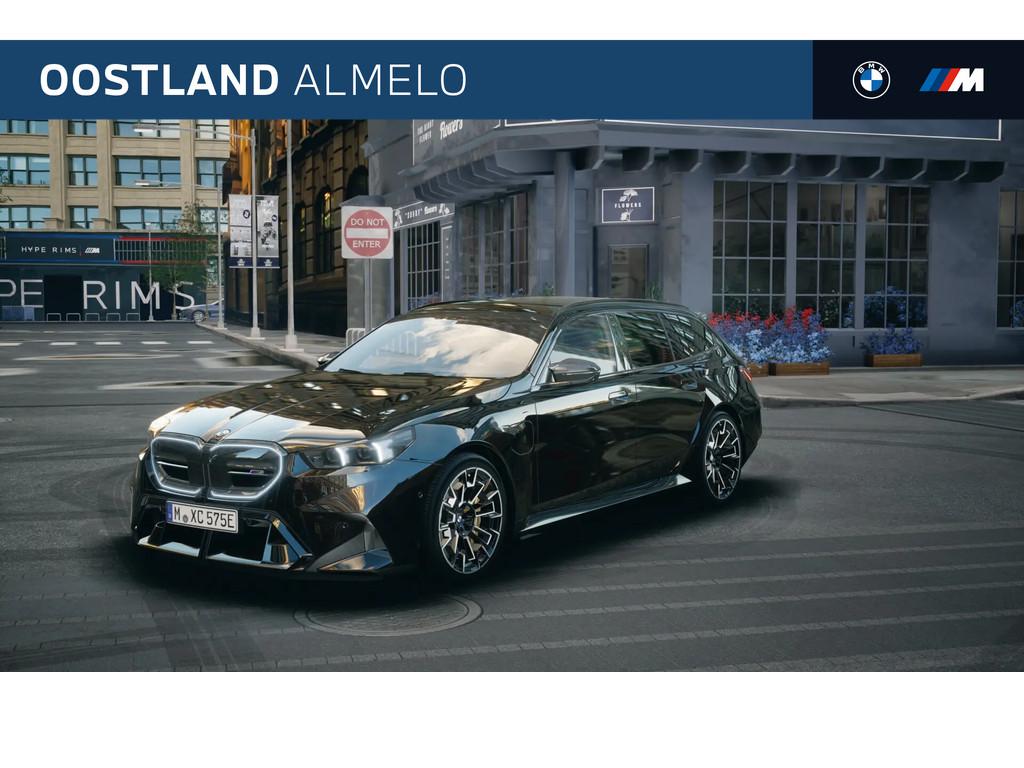 BMW 5 Serie Touring M5 Automaat / Trekhaak / Panoramadak / C, Auto's, 4395 cc, Zwart, Leder, Hybride Elektrisch/Benzine