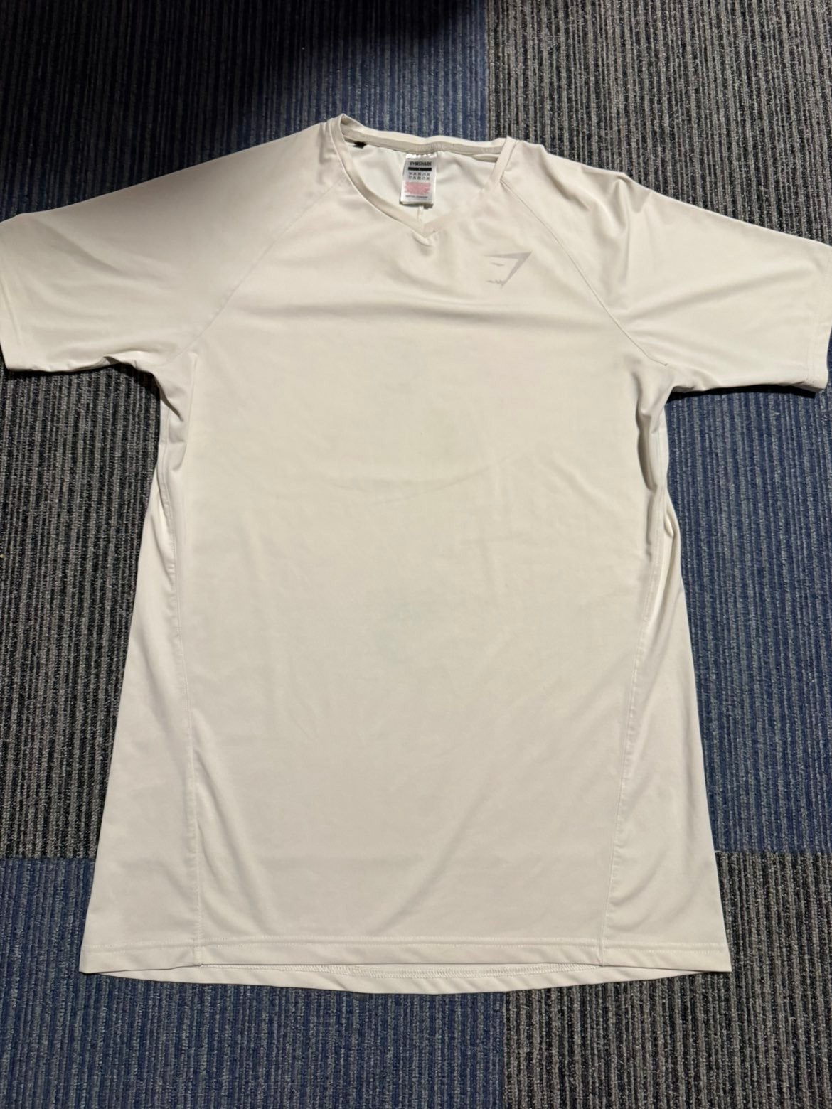 Gymshark T-shirt - 100% origineel en in topstaat, Maat 52/54 (L), Fitness, Ophalen of Verzenden, Zo goed als nieuw