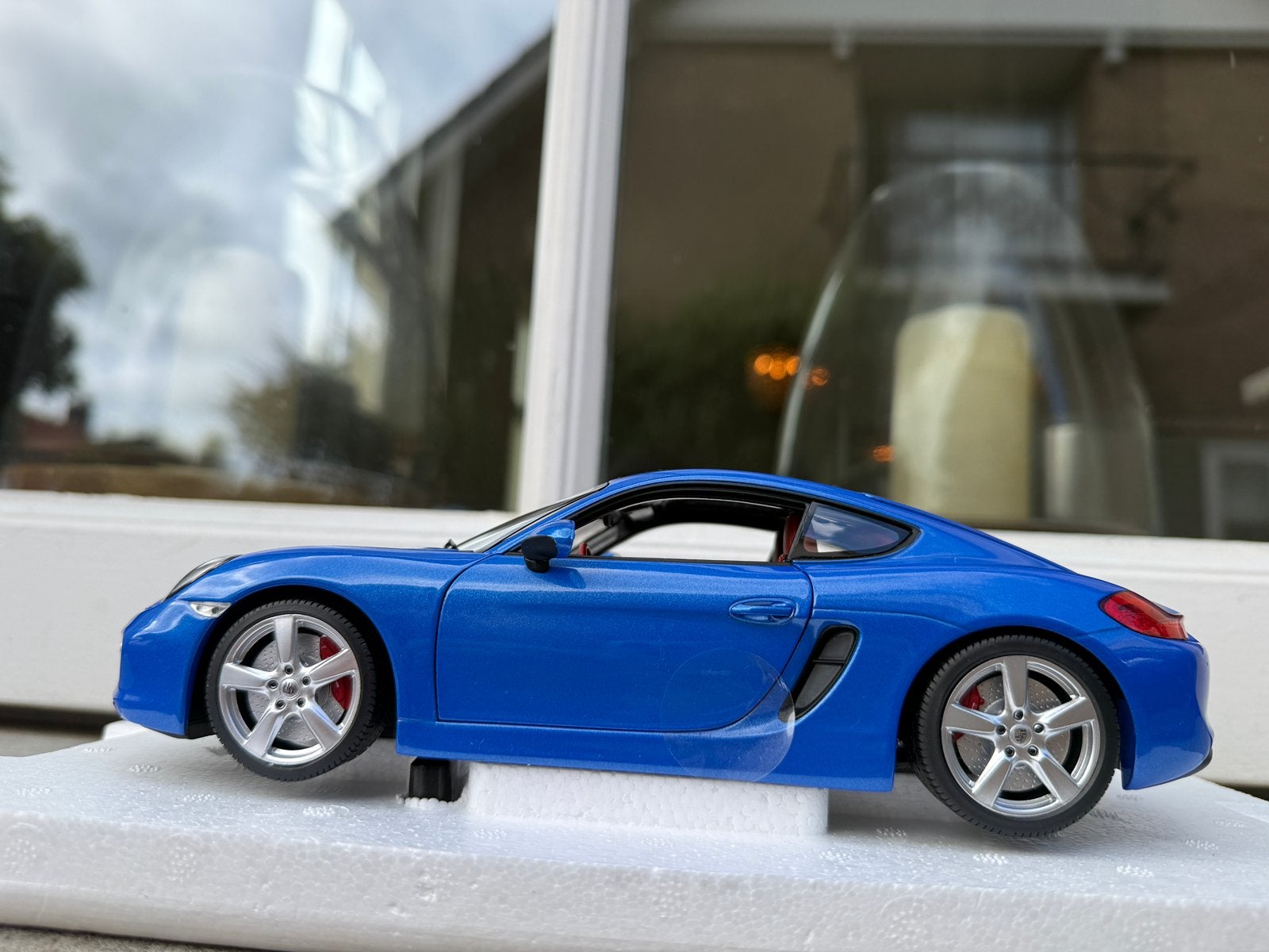 1:18 Porsche 981 Cayman blauw 2013 Minichamps, Hobby en Vrije tijd, Minichamps, Auto, Nieuw, Ophalen of Verzenden