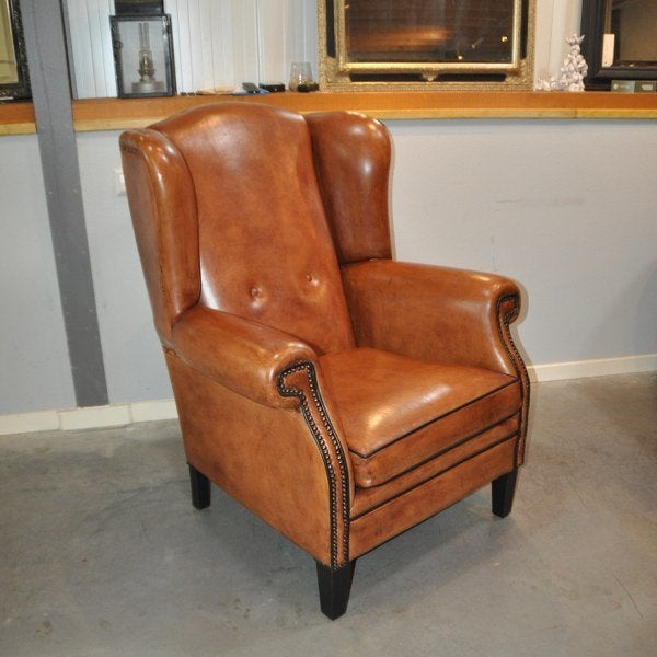 Nieuwe grote oorfauteuil in schapenleer., Ophalen, Nieuw, Leer, 125 cm of meer