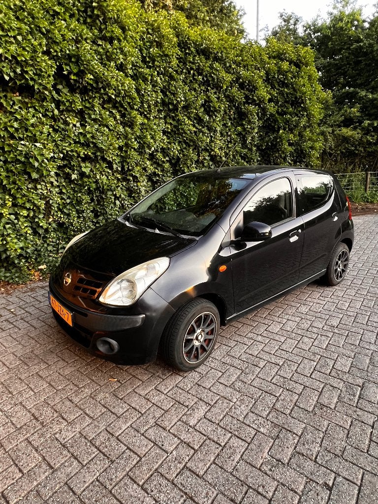 Nissan Pixo 1.0 50KW 5D 2009 Zwart, Auto's, Nissan, Voorwielaandrijving, Stof, 200 kg, 4 stoelen