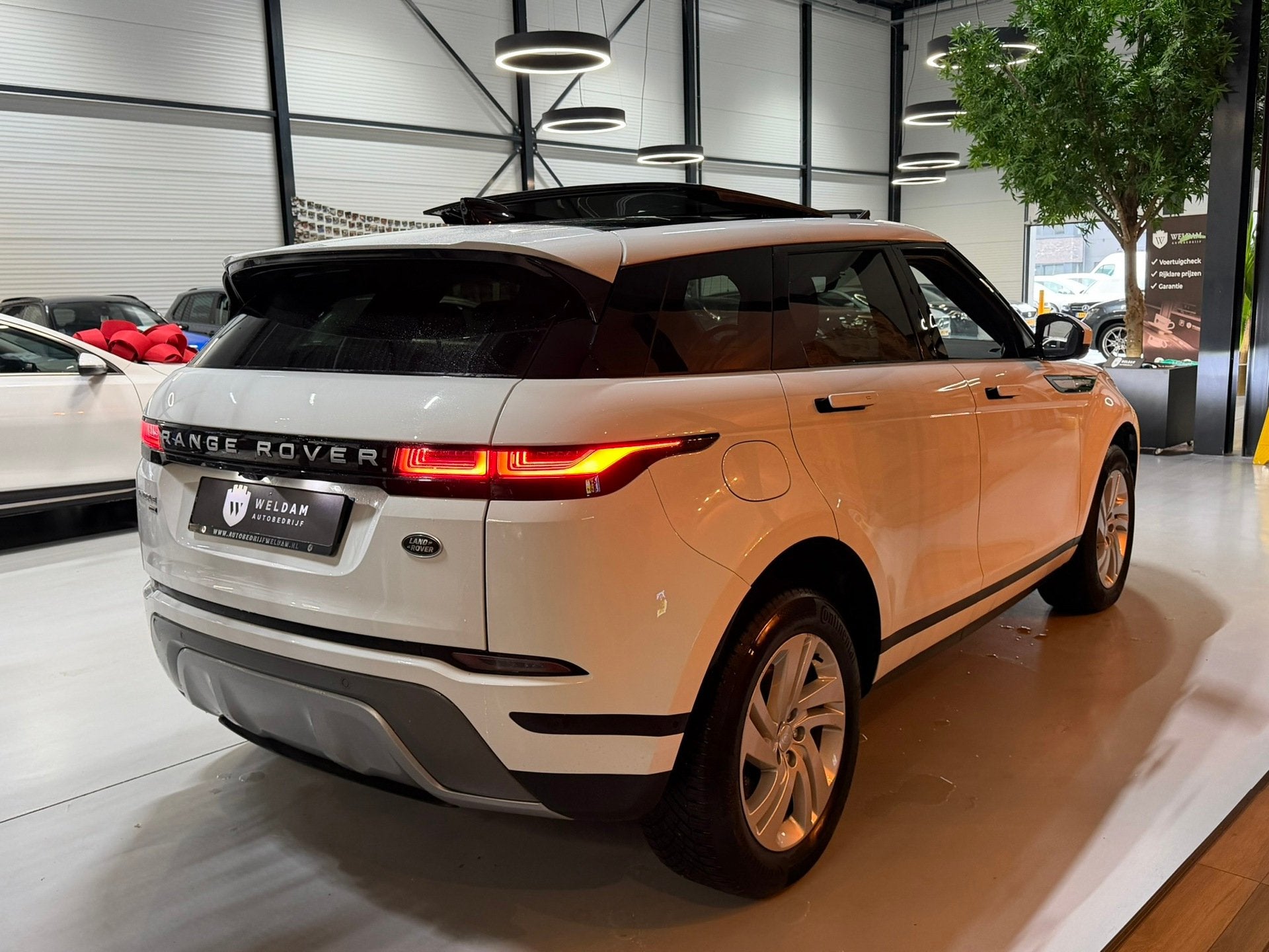 Land Rover Range Rover Evoque 1.5 P300e AWD Garantie|1e Eig|, Auto's, Automaat, Parkeersensor, Met garantie (alle), Wit