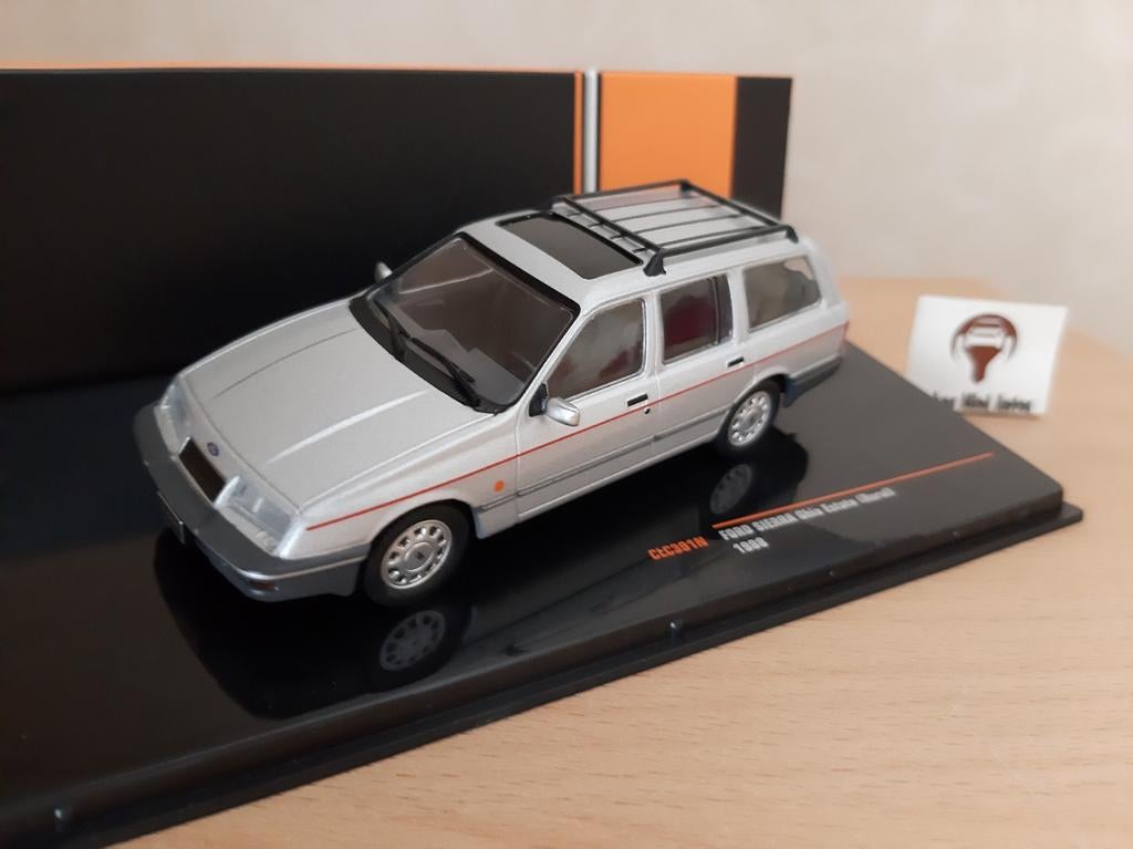 Ford Sierra Turnier Ghia 1986 zilvermetallic van IXO 1:43