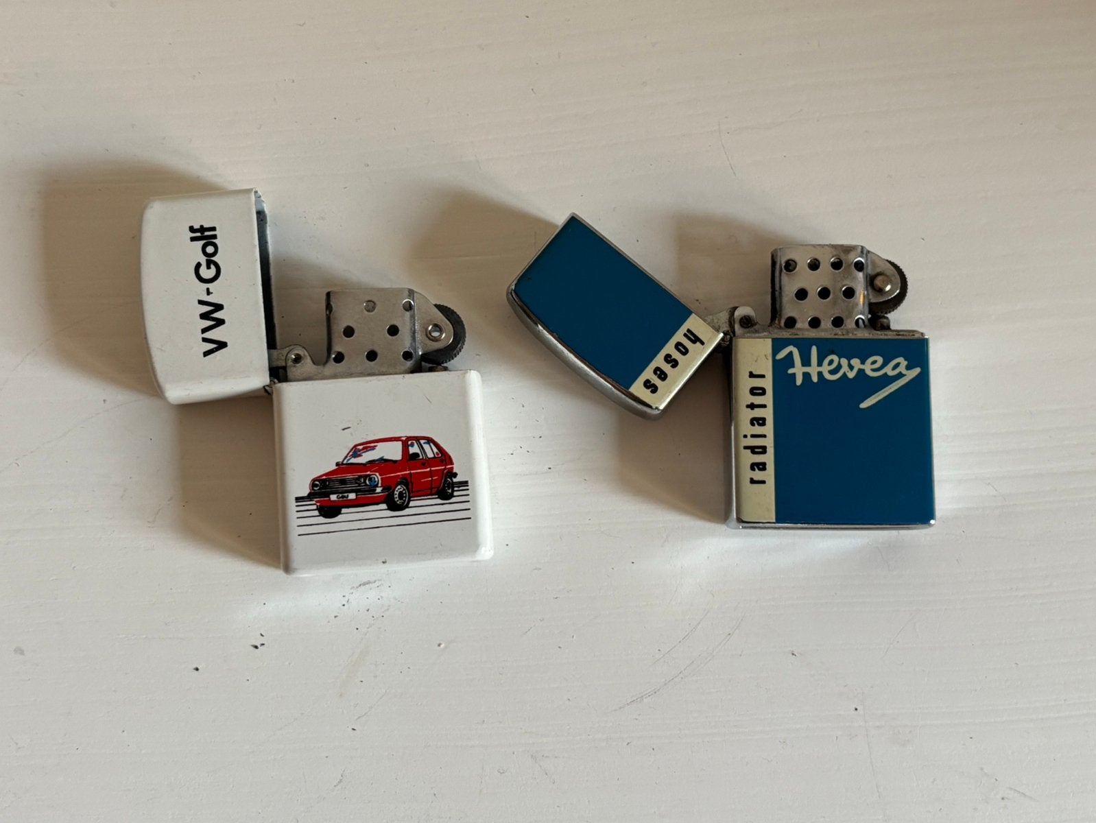 Vintage VW Golf en Hevea reclameaanstekers, Ophalen of Verzenden, Aansteker