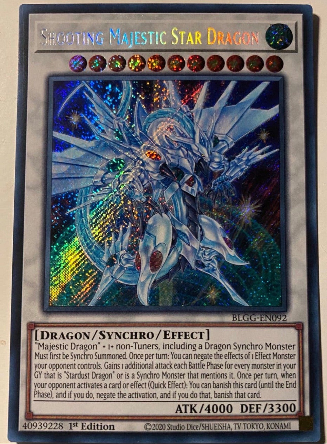 Yu-Gi-Oh! Shooting Majestic Star Dragon BLGG 1st Edition !, Ophalen of Verzenden, Zo goed als nieuw, Losse kaart, Foil