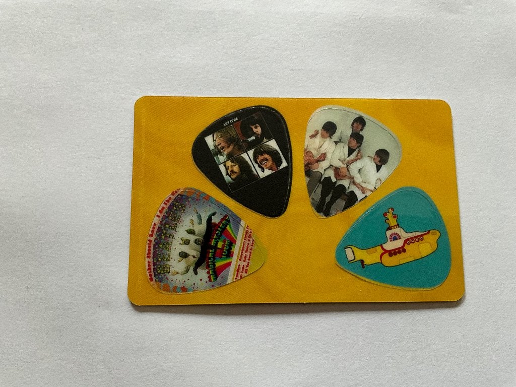 4 uitneembare plectrums van The Beatles, Nieuw, Ophalen of Verzenden, Foto of Kaart, 4 uitneembare plectrums van The Beatles