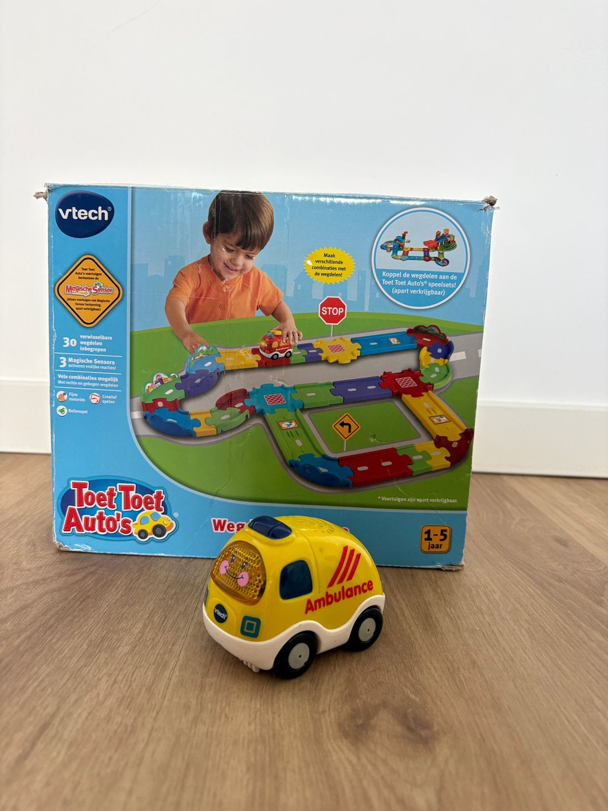 VTech Toet Toet Auto's Wegdelen Deluxe + Ans Ambulance ZGAN, Ophalen, Zo goed als nieuw, 6 maanden tot 2 jaar