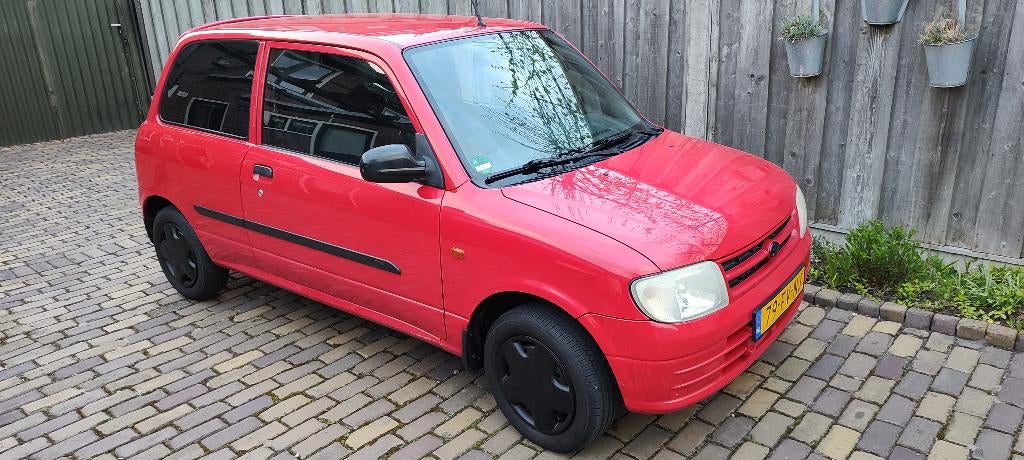 Daihatsu Cuore automaat 94755 km, rijden met weinig onkosten, Auto's, Stof, Daihatsu, Grijs, Particulier