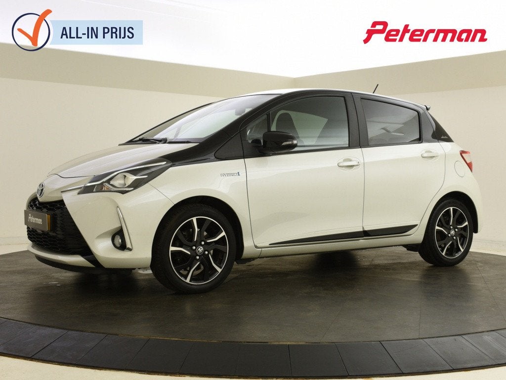 Toyota Yaris 1.5 Hybrid Bi-Tone | Navigatie | Keyless | Stoe, Auto's, Euro 6, 4 cilinders, 100 pk, Wit