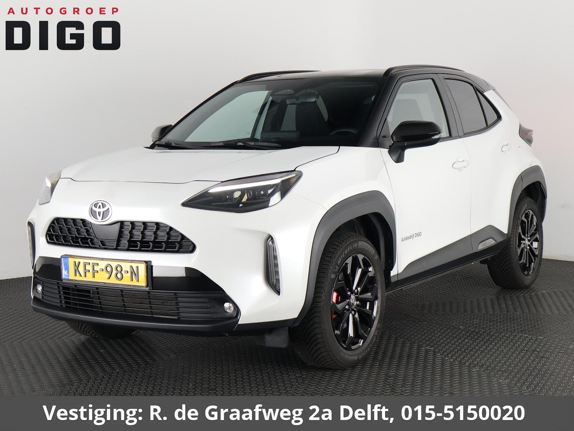 Toyota Yaris Cross Hybrid 115 Dynamic Sport Bi-Tone | Stuur-, Auto's, Stof, 1165 kg, Automatische klimaatregeling, Wit