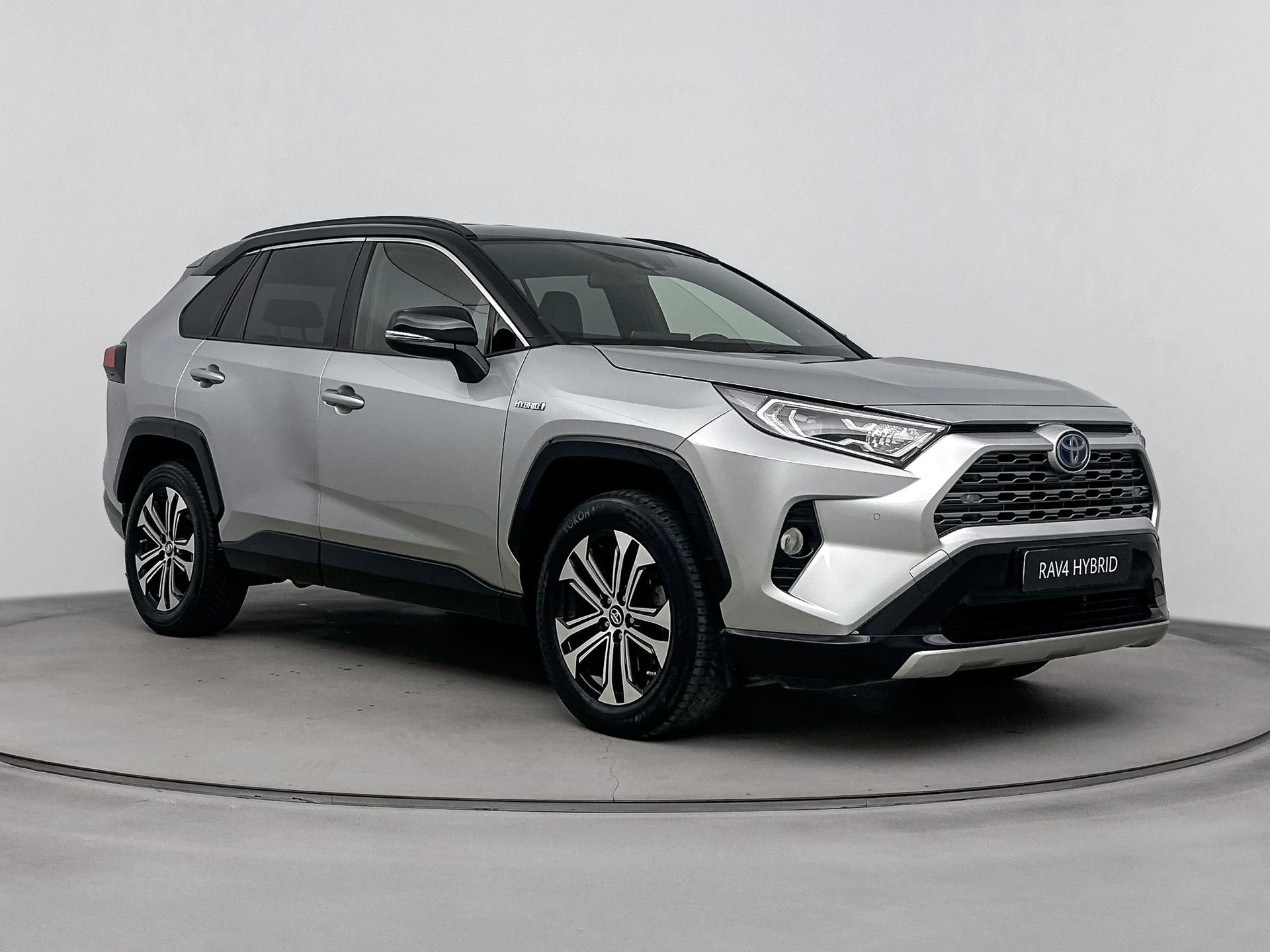 Toyota RAV4 2.5 Hybrid Bi-Tone | JBL-Audio | Navigatie | Par, Auto's, Gebruikt, 4 cilinders, Bedrijf, Automatische klimaatregeling