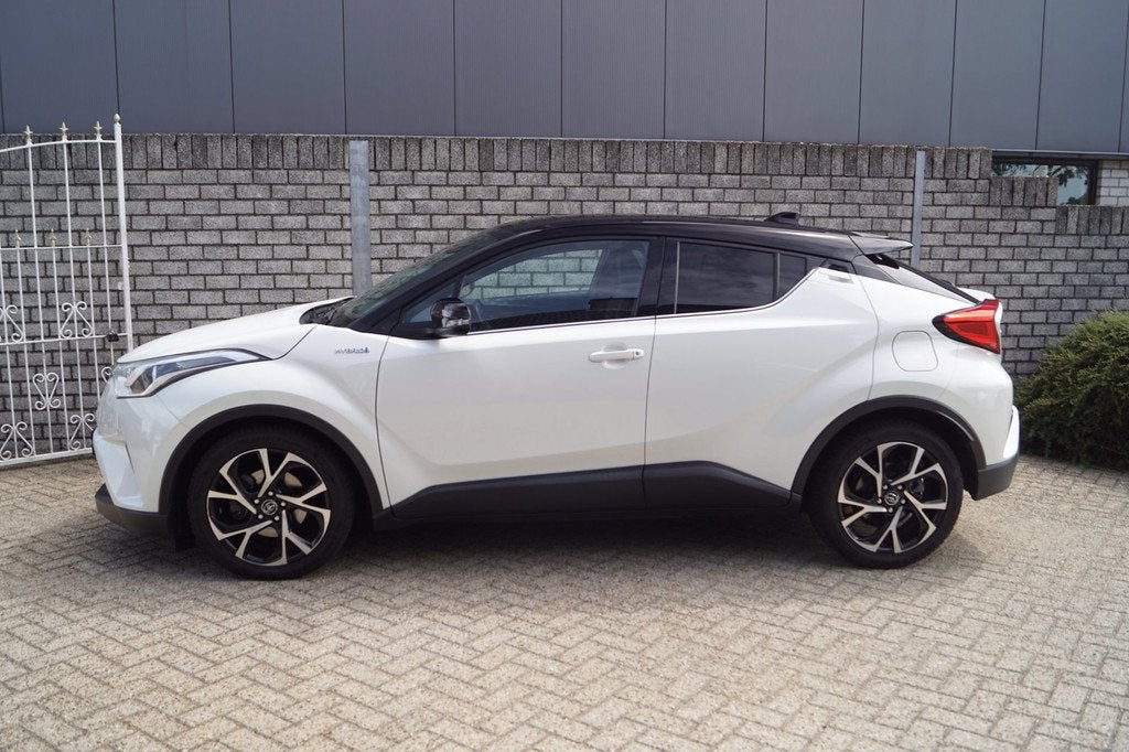 Toyota C-HR 1.8 Hybrid Bi-Tone Autom Navi Camera Clima Adapt, Auto's, Toyota, Stof, 4 cilinders, Wit, Hybride Elektrisch/Benzine