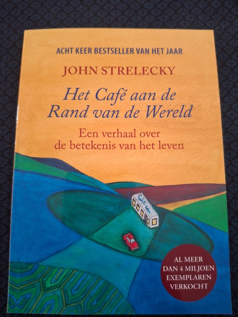 John P. Strelecky - Het café aan de rand van de wereld, Boeken, Ophalen of Verzenden, Zo goed als nieuw, John P. Strelecky