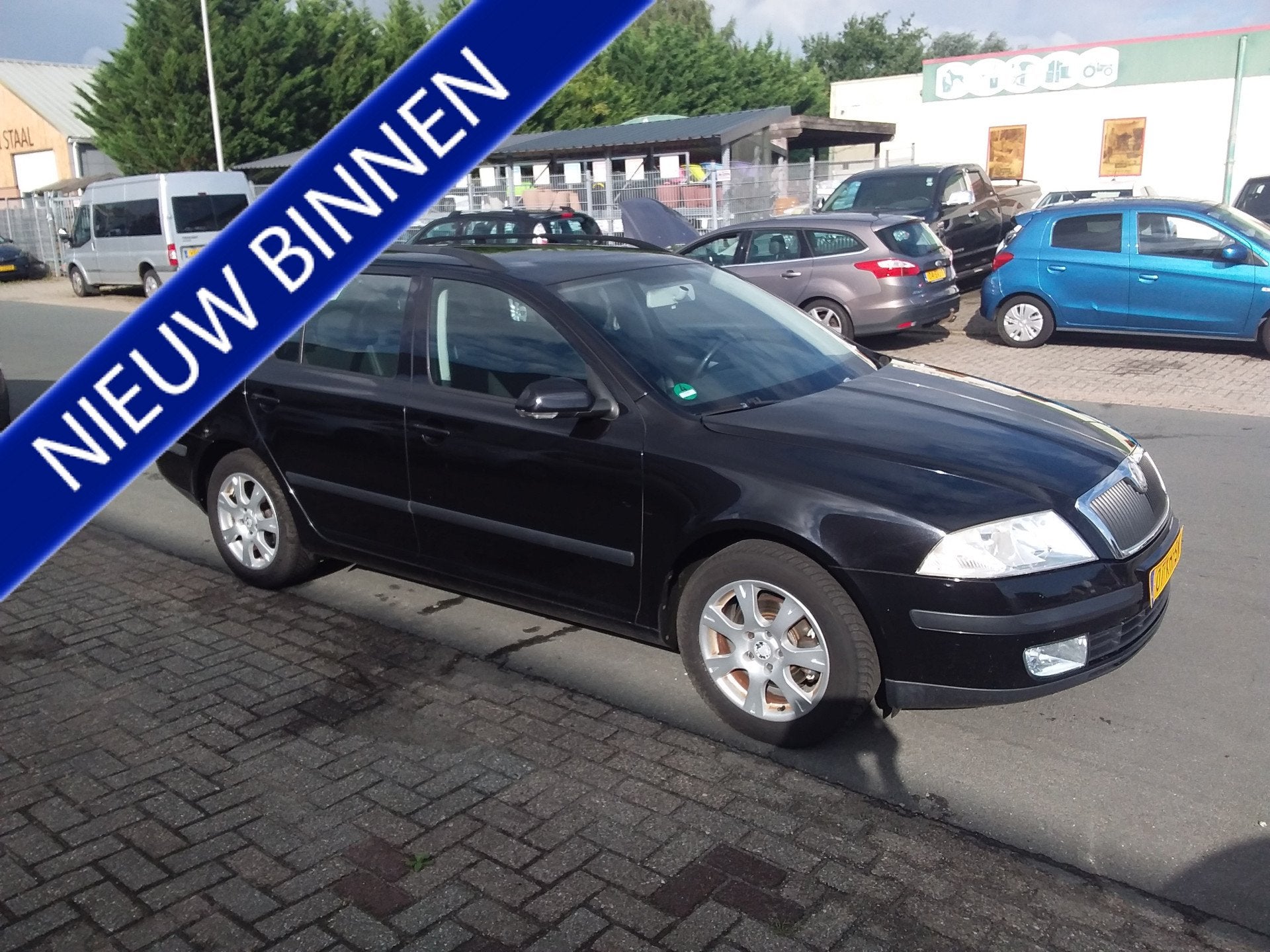 Skoda Octavia Combi 1.6 Ambiente (bj 2007), Auto's, Voorwielaandrijving, Gebruikt, Zwart, 4 cilinders