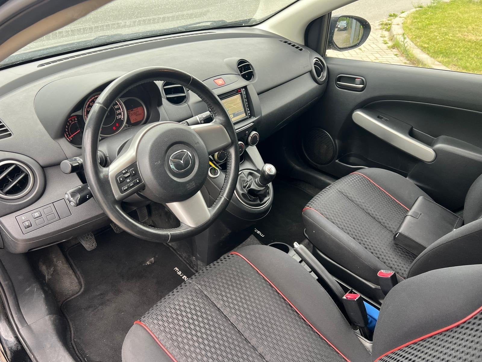 Mazda 2 1.3 BIFUEL Navigator GT 2012 LPG G3 Cruise Navi 5DRS, Voorwielaandrijving, Stof, Zwart, 4 cilinders