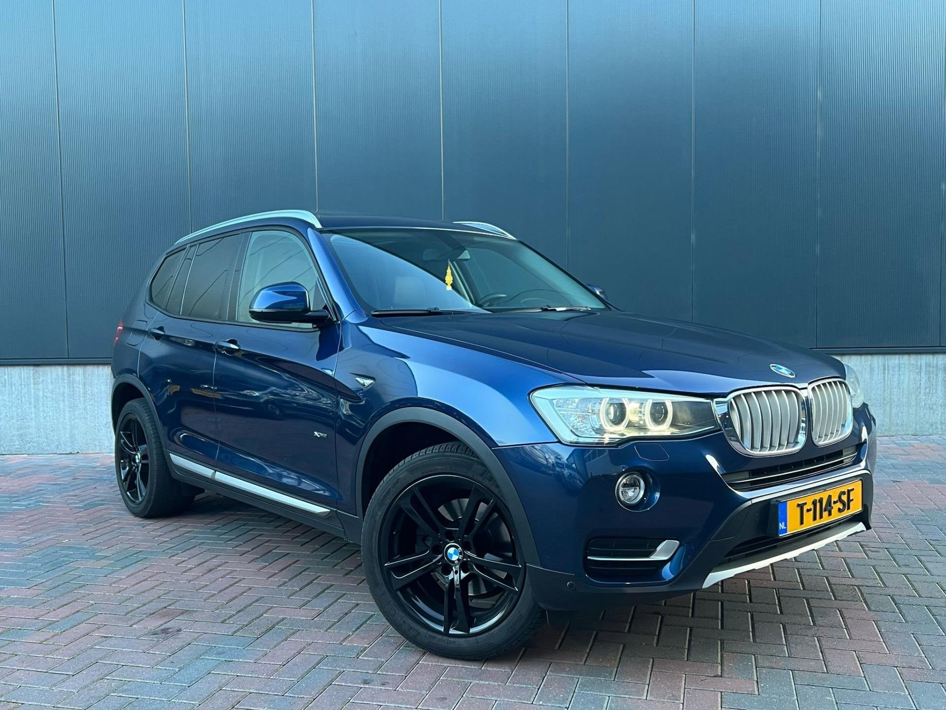 BMW X3 XDrive20d High executive X-Line * Aut * Navi * Cruise, Auto's, Automaat, Dealer onderhouden, Zwart, Blauw