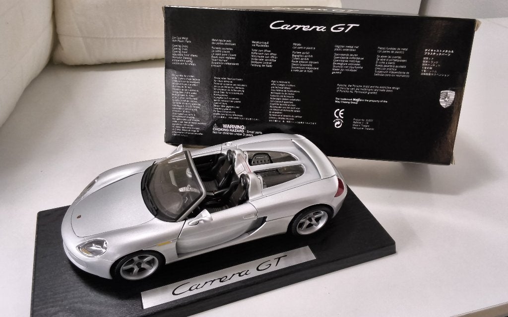 1/18 Porsche Carrera  GT  dealer uitvoering, Ophalen of Verzenden, Zo goed als nieuw, Auto, Maisto