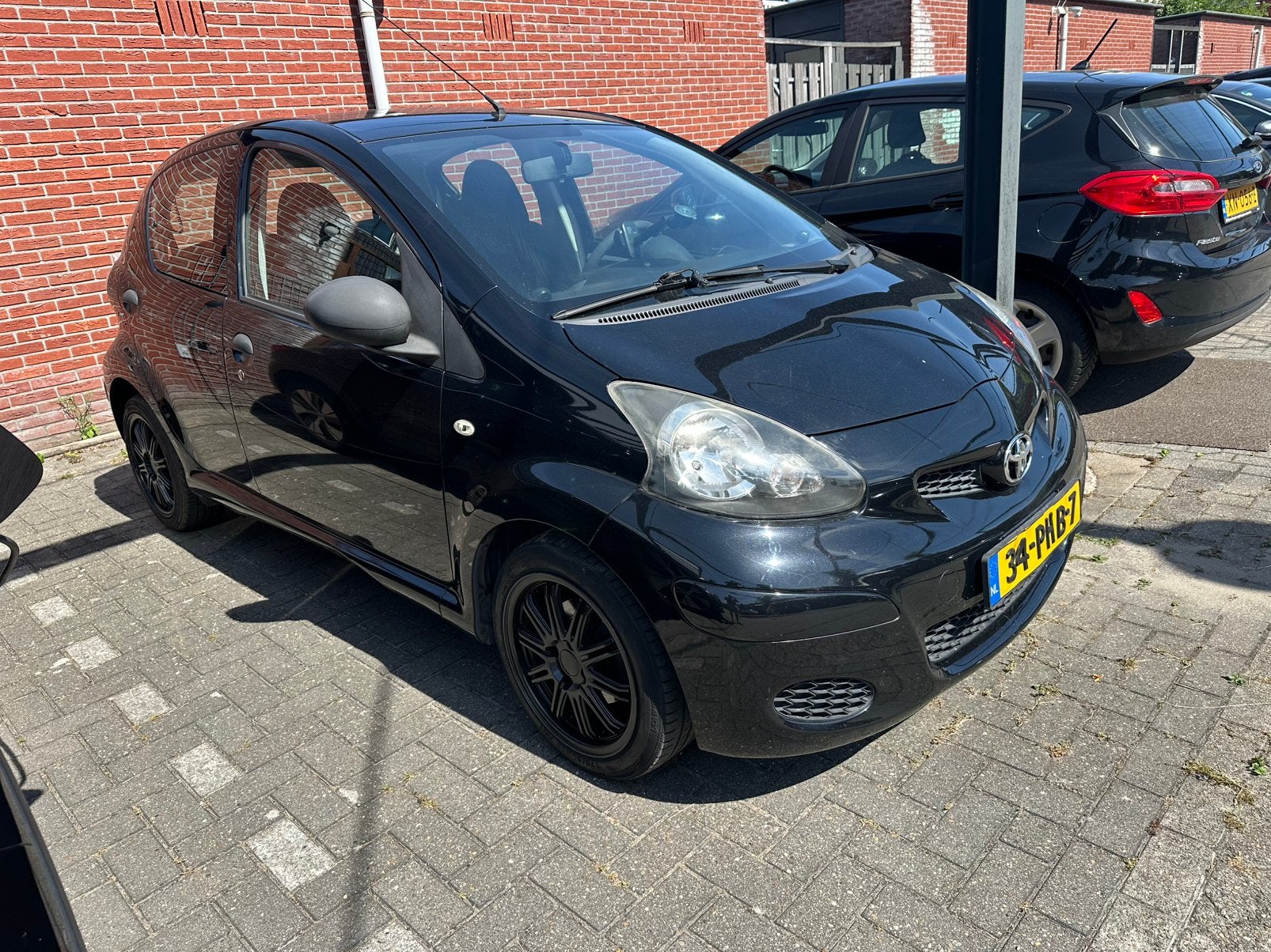 Toyota Aygo 1.0 12V Vvt-i 5DRS 2011 Zwart, Auto's, Voorwielaandrijving, 4 stoelen, Bedrijf, Handgeschakeld
