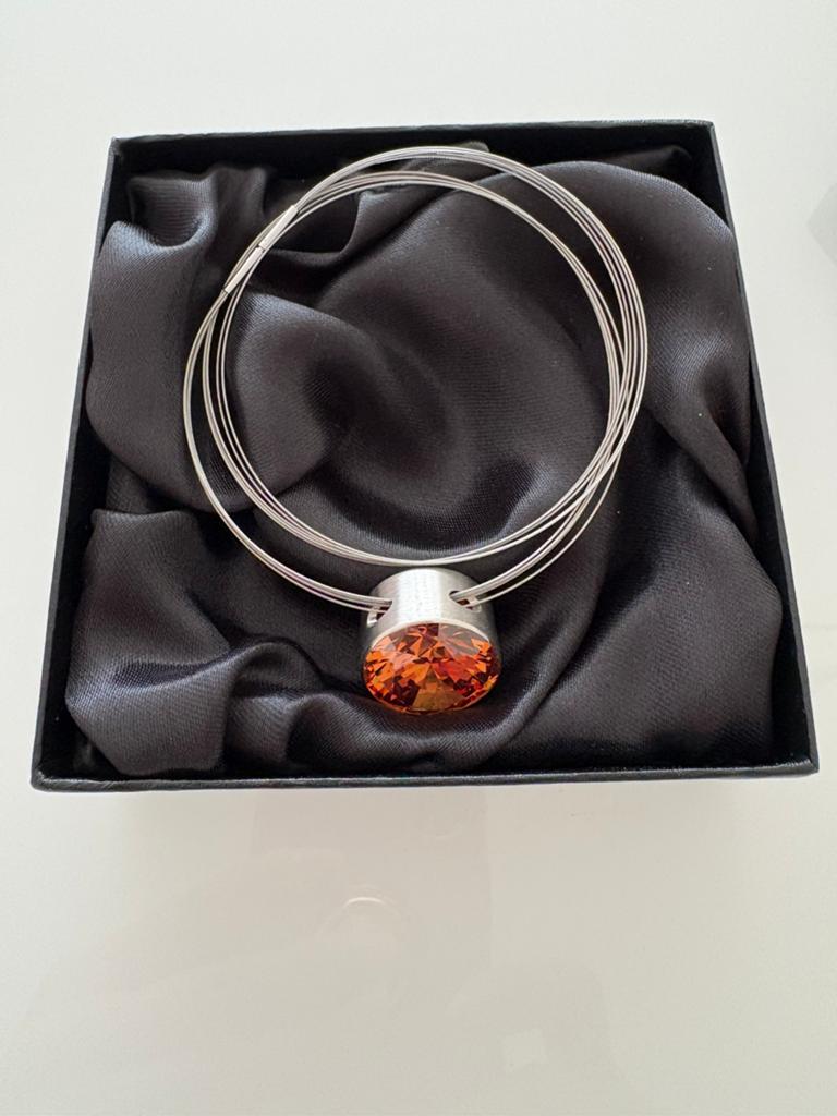 Melano ketting met oranje steen, Overige materialen, Nieuw, Ophalen of Verzenden, Met edelsteen