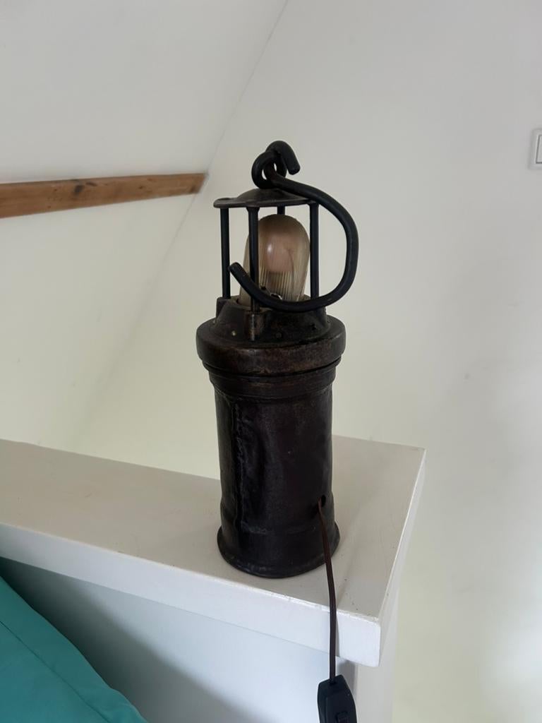 Mijnwerkerslamp, Ophalen