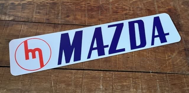 MAZDA  reclamebord kentekenplaat formaat  52x11 cm kunststof, Ophalen of Verzenden, Zo goed als nieuw, Auto's