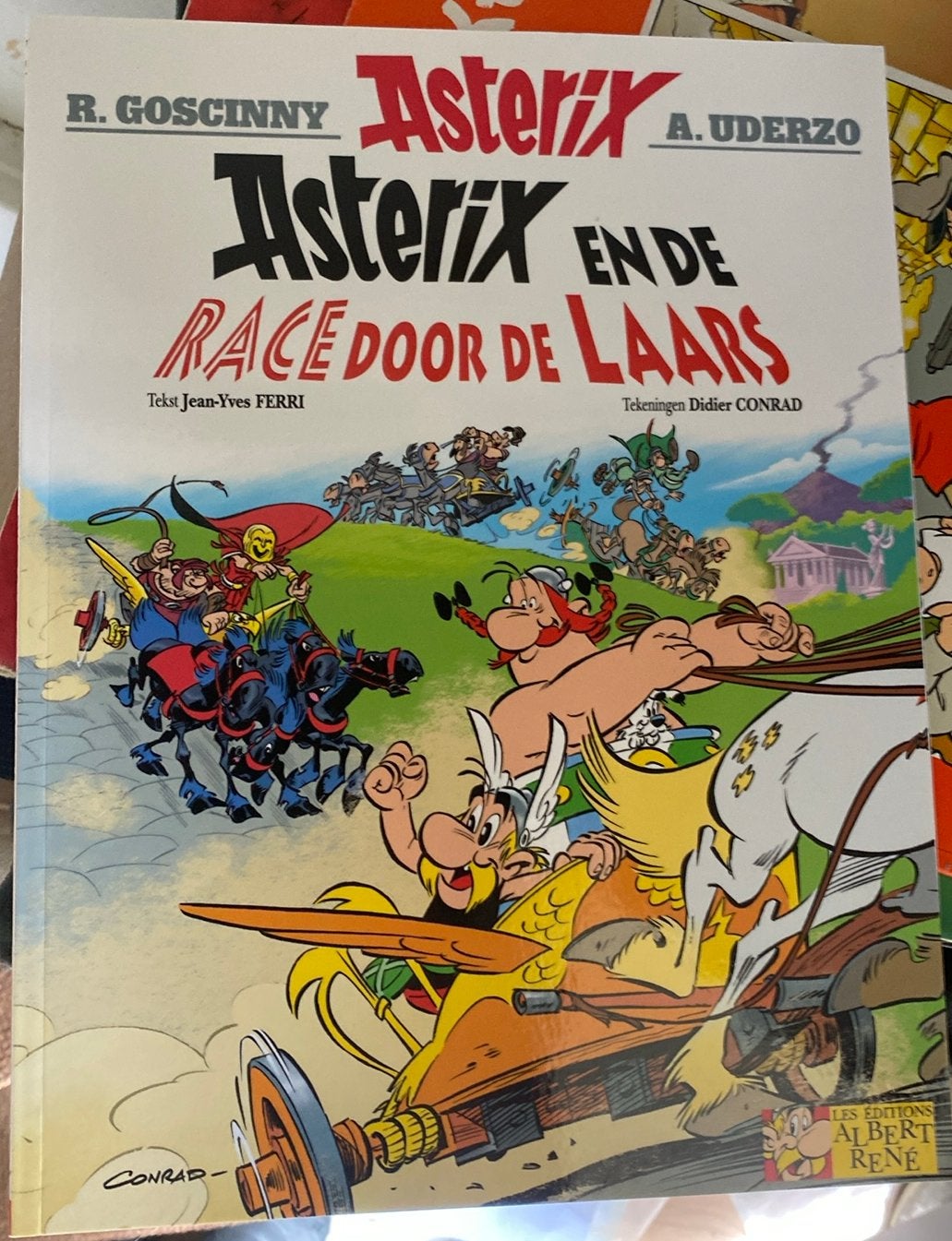 Asterix’ strip en de race door de Laars, Eén stripboek, Ophalen of Verzenden, Zo goed als nieuw