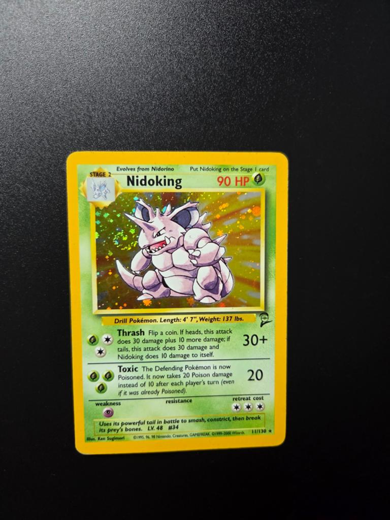 Nidoking 11/130 Pokemon Base 2 Holo WOTC swirl, Ophalen of Verzenden, Zo goed als nieuw, Booster, Foil