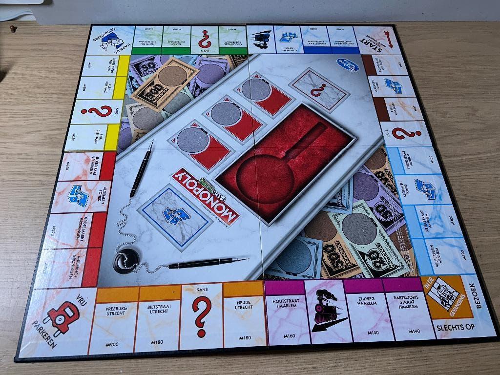 Monopoly Vals Geld Editie Bordspel, Ophalen of Verzenden, Zo goed als nieuw