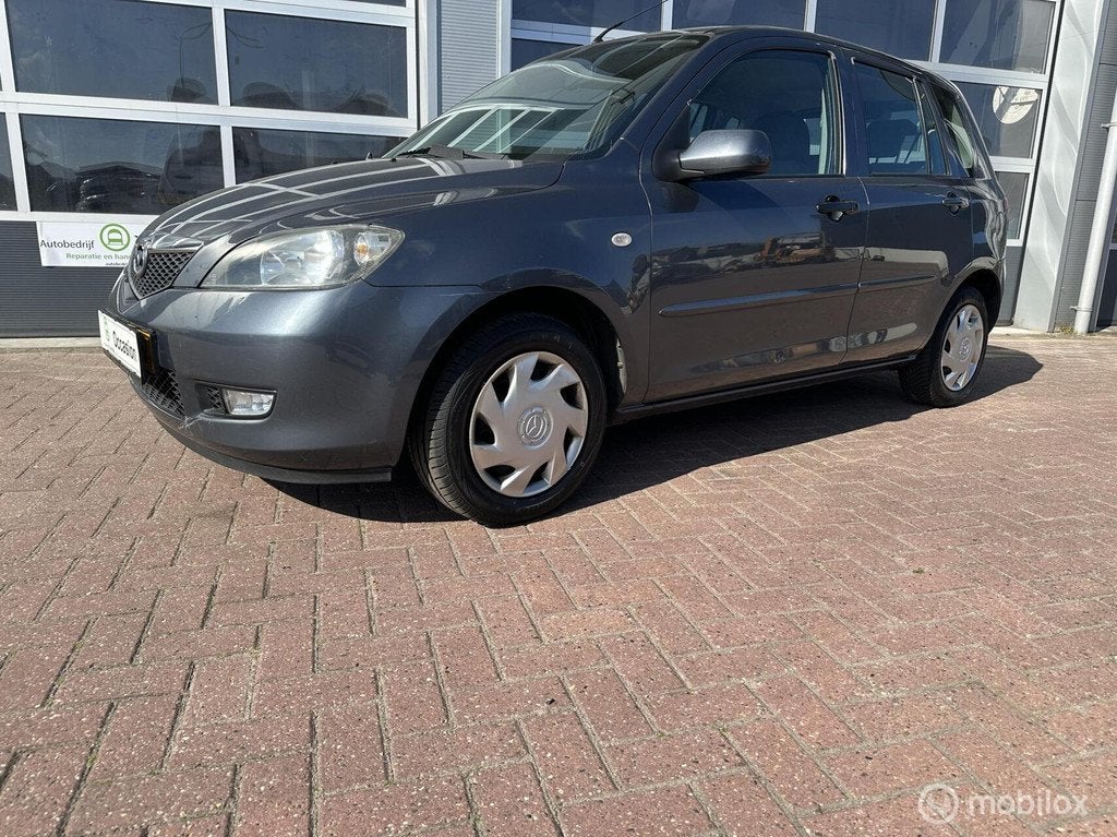 Mazda 2 1.4 Touring met trekhaak en airco, Auto's, Mazda, Voorwielaandrijving, 40 €/maand, 4 cilinders, Elektrische ramen