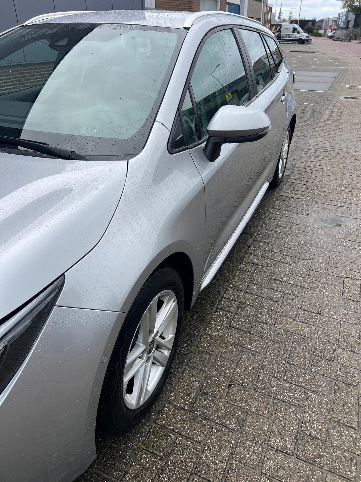 Toyota Corolla TS 1.8 Hybrid 122pk CVT 2022 Grijs, Auto's, 4 cilinders, Verwarmde buitenspiegels, 98 pk, Stationwagon