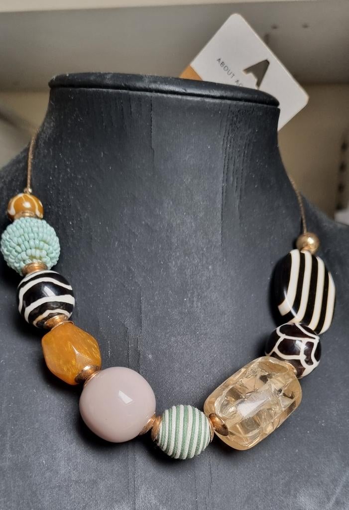 Afrikaans motief, ketting., Sieraden, Tassen en Uiterlijk, Kettingen, Ophalen of Verzenden, Nieuw, Overige materialen