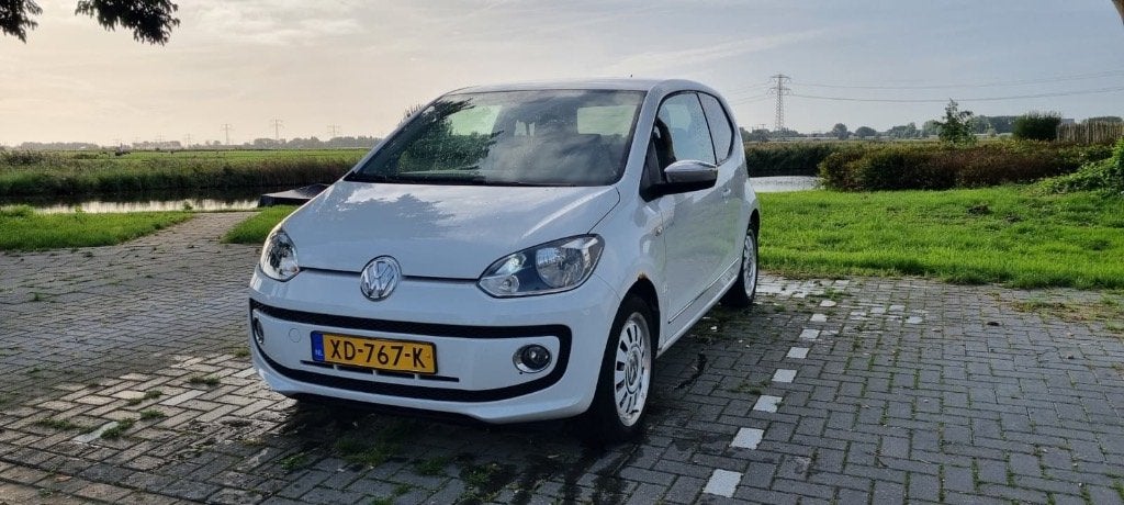 Volkswagen up! 1.0 44KW 2012 Wit, Auto's, Euro 5, Achterwielaandrijving, Up!, Leder en Stof